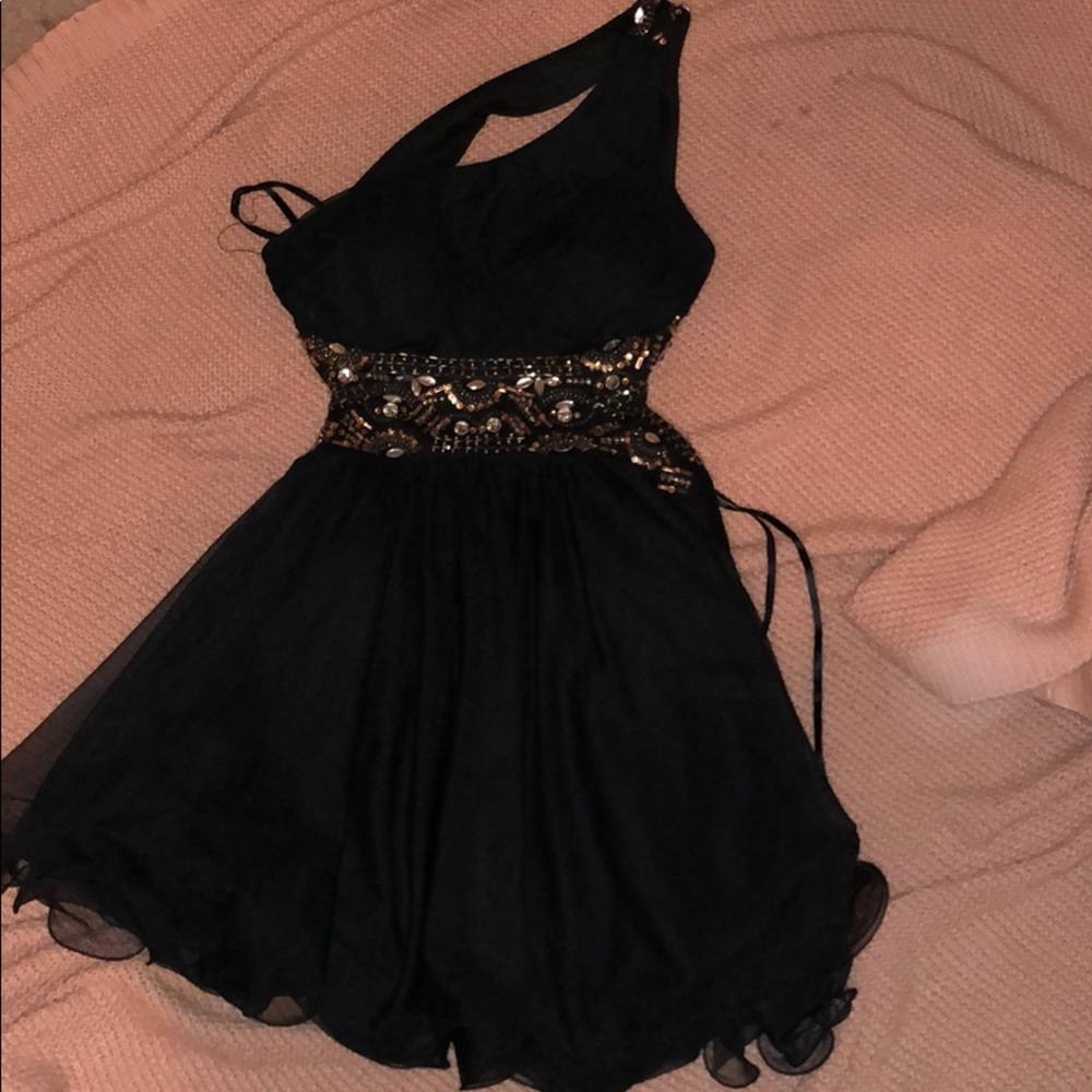 black dress with gold and silver embellishments